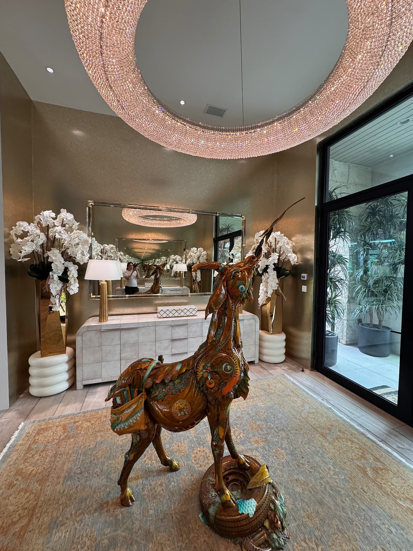 Entryway with a metallic wallcovering, installed by The Style Maison