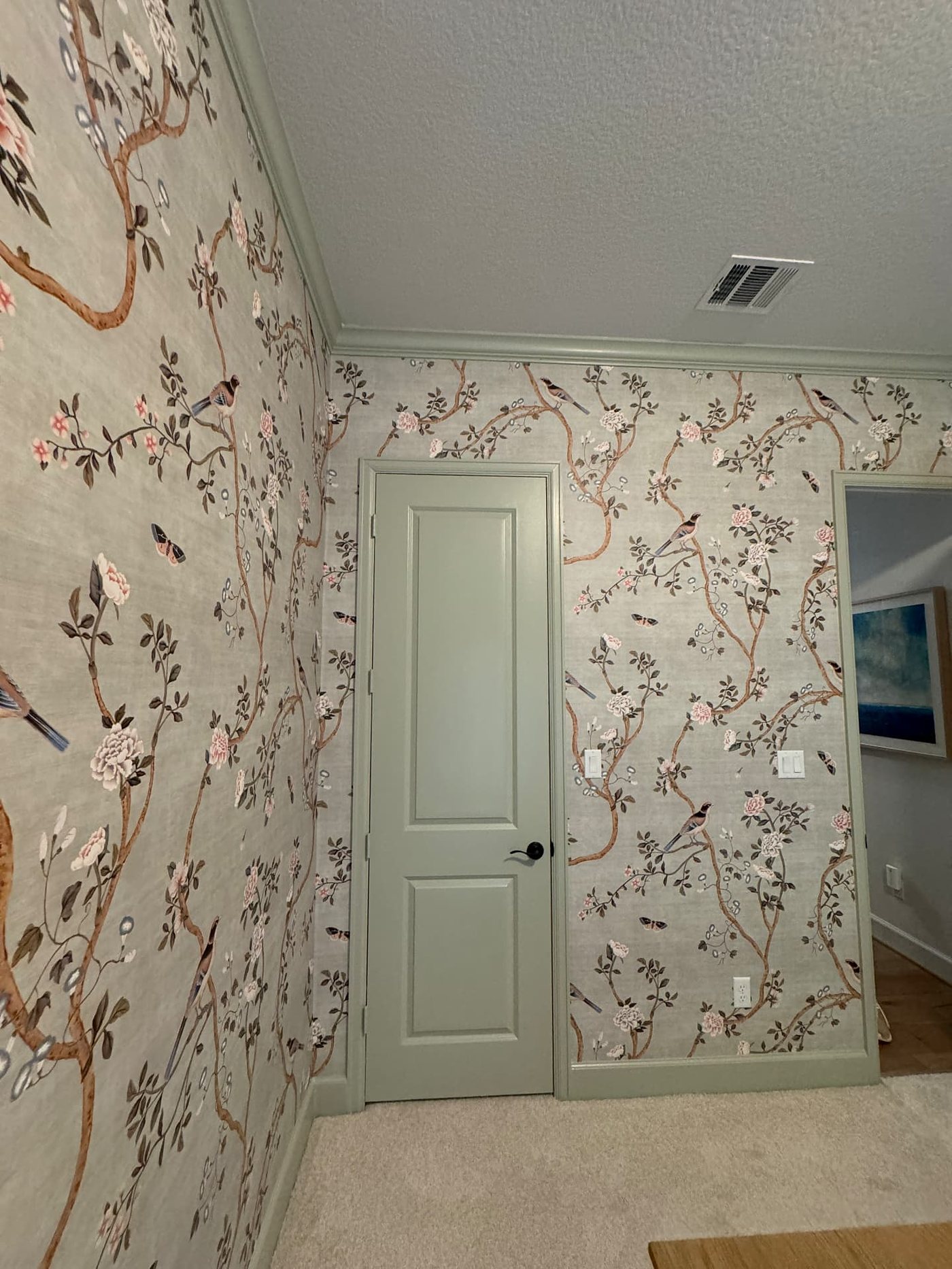 Hallway with chinoiserie grasscloth wallpaper, installed by The Style Maison
