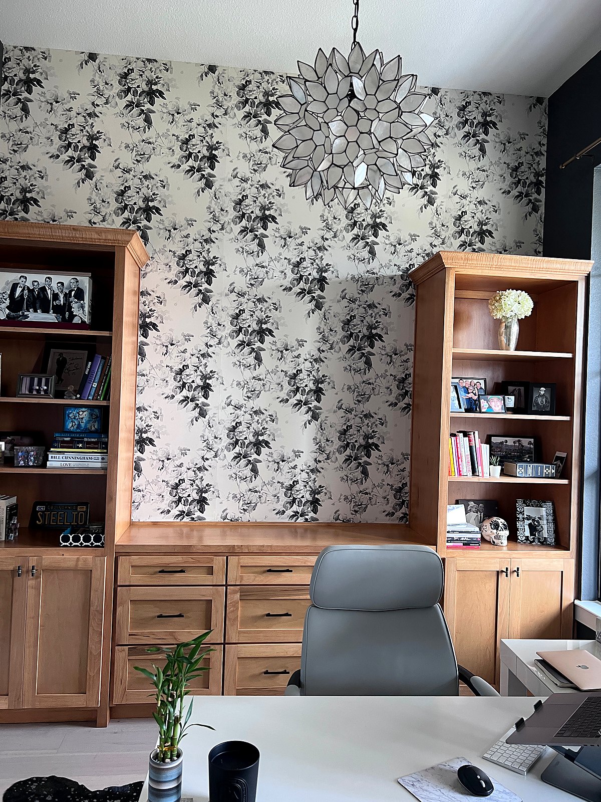 Black and white floral accent wall in a home office
