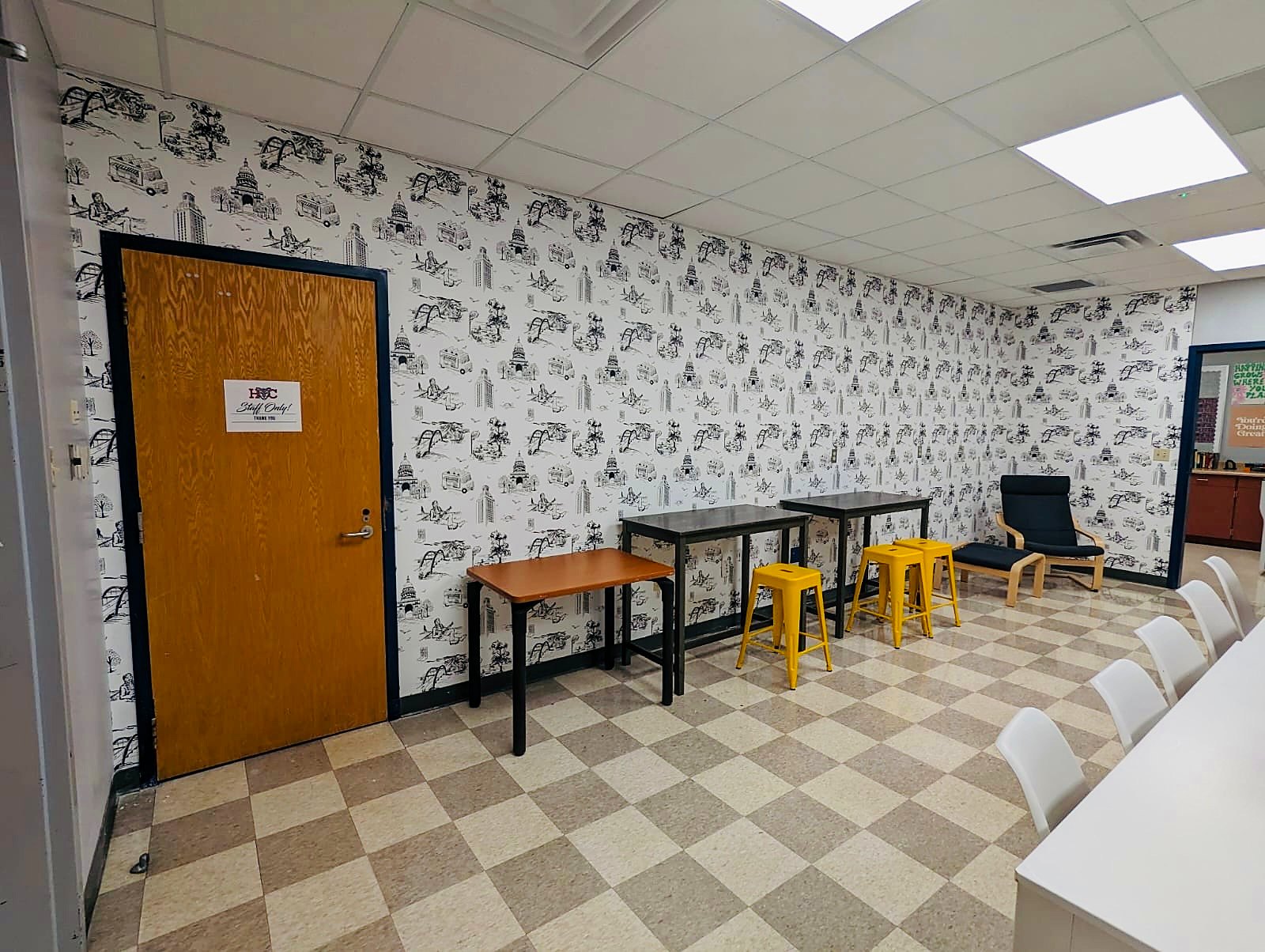 Patterned wallpaper in a commercial break room, installed by The Style Maison